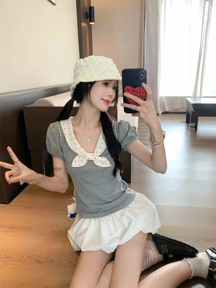 Áo tay phồng cổ cột nơ chấm bi nữ tính