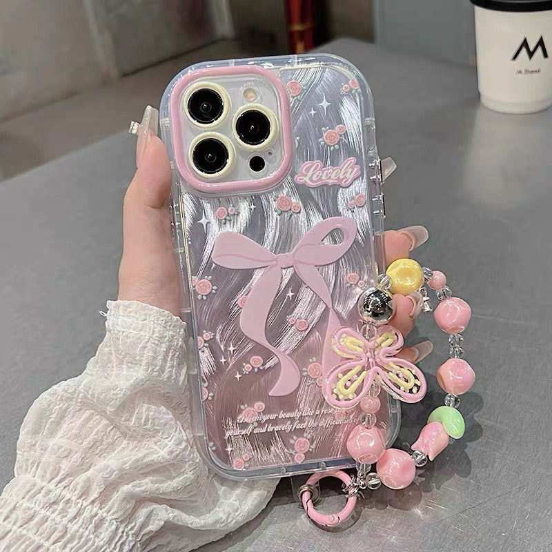 Ốp lưng IP nơ hồng kèm dây đeo tay