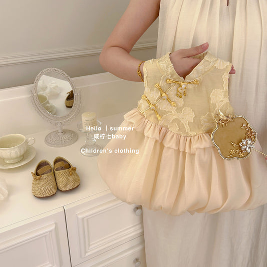 Đầm vàng cổ tàu cho bé gái