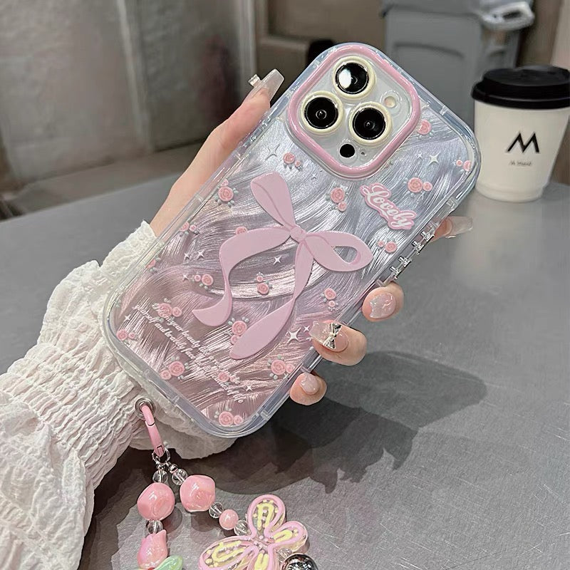 Ốp lưng IP nơ hồng kèm dây đeo tay