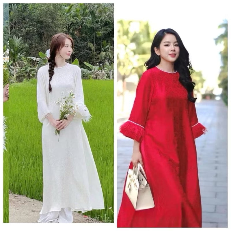 Áo dài gấm dáng xuông tay loe đính viền lông vũ