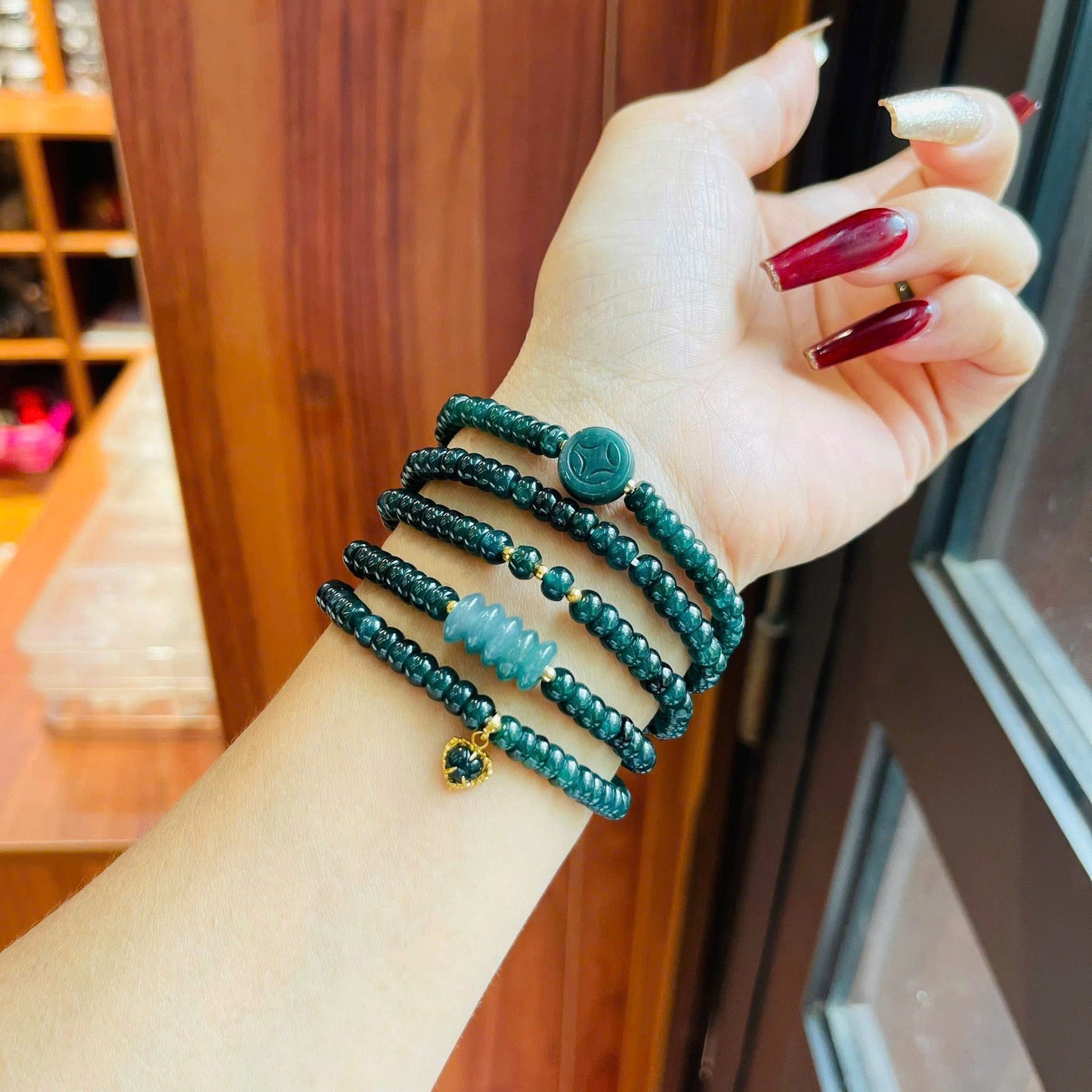 Vòng chuỗi Lam Ngọc bánh xe mix ngũ điếu – xu – charm tim vàng 10k