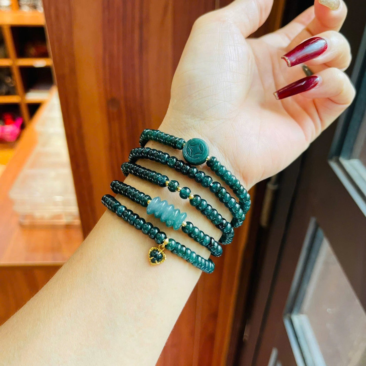 Vòng chuỗi Lam Ngọc bánh xe mix ngũ điếu – xu – charm tim vàng 10k