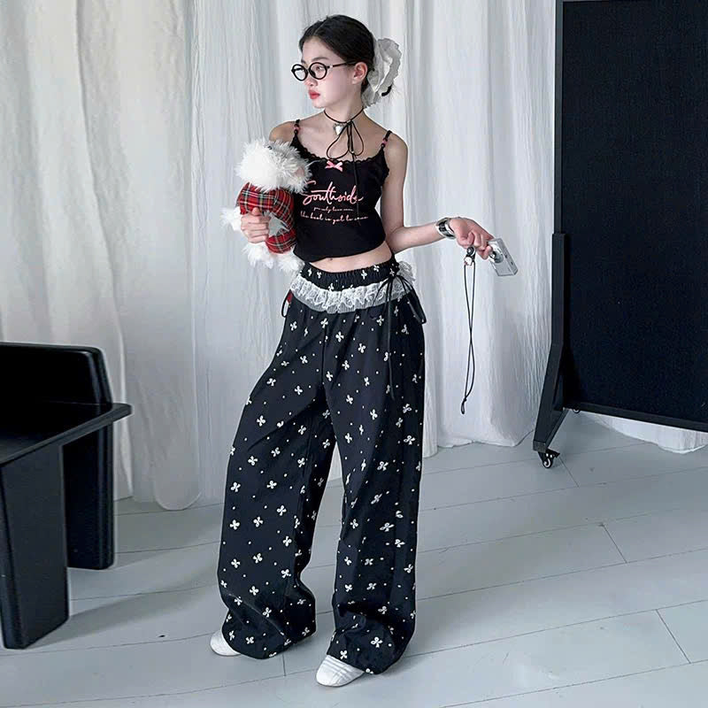 Áo 2 dây đen nơ xinh phối quần ống rộng viền ren