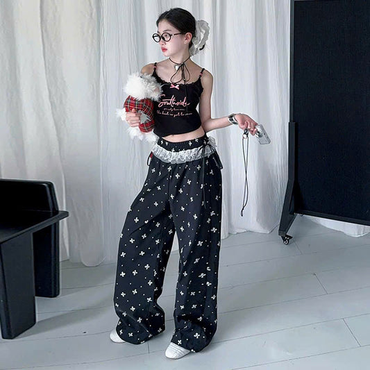 Áo 2 dây đen nơ xinh phối quần ống rộng viền ren