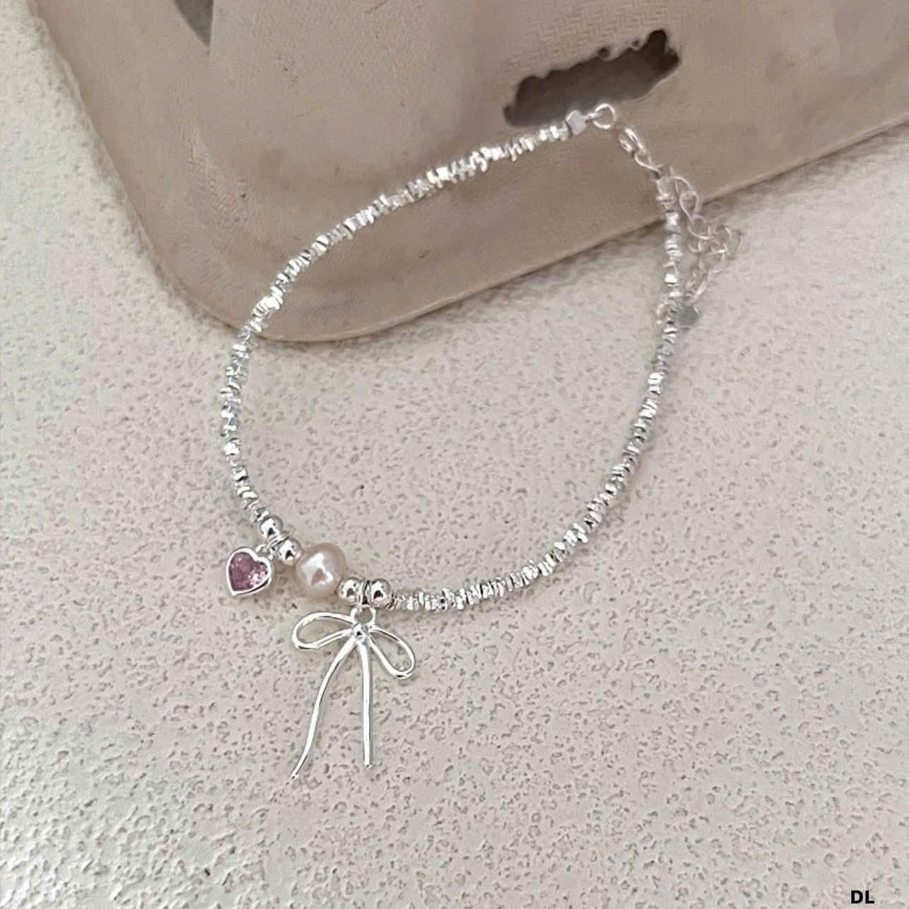 Lắc bạc lấp lánh & charm tim nơ nhỏ