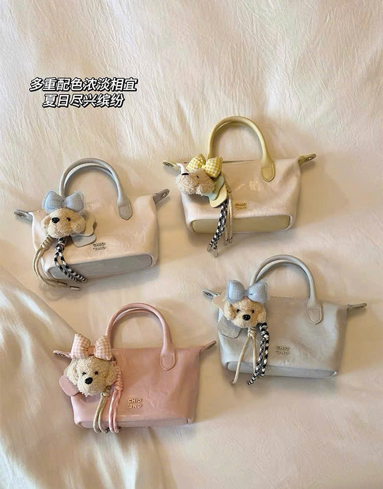 Túi cầm tay đeo vai charm cún nơ Chio'2nd