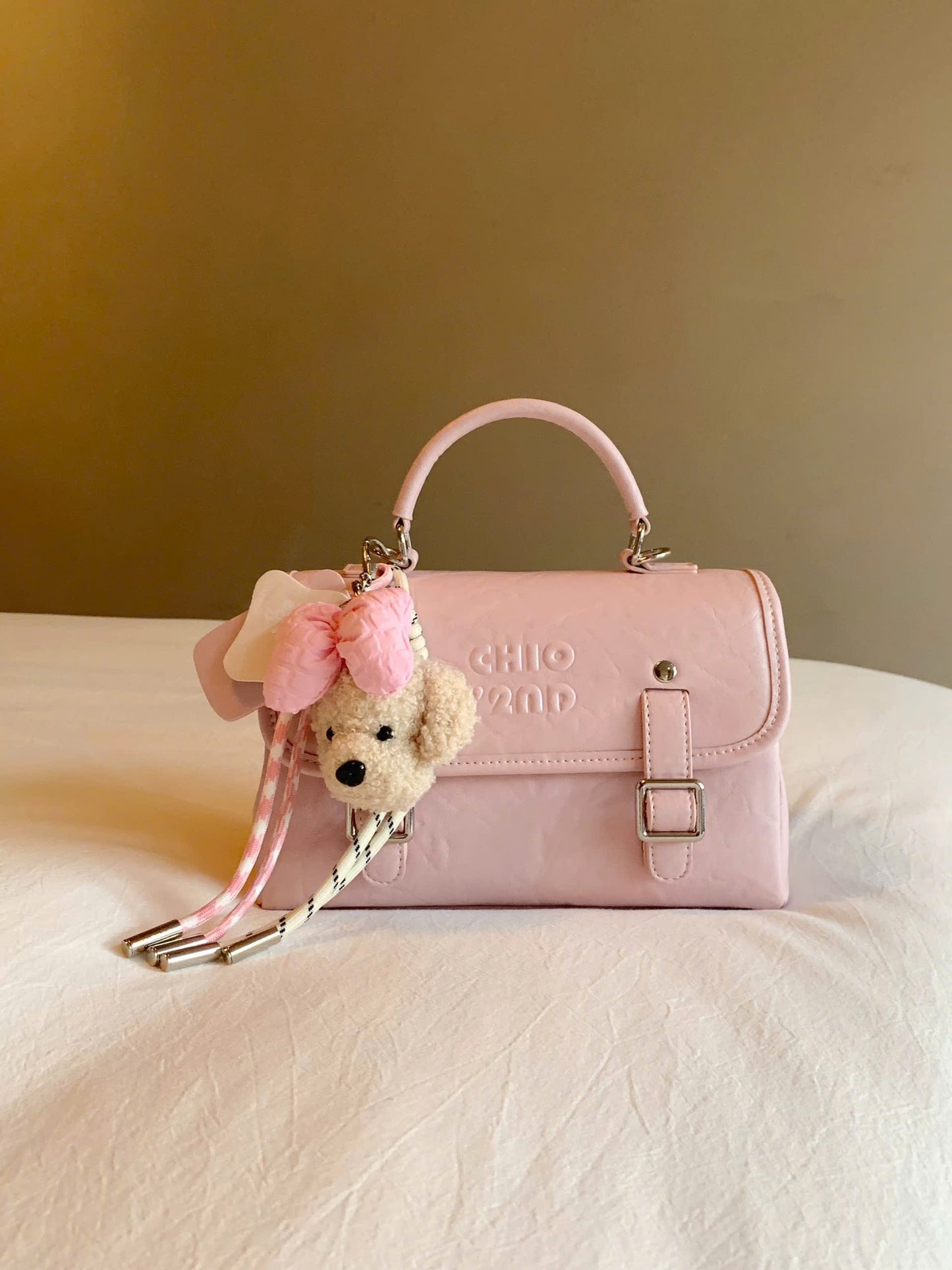 Túi đeo vai kiêm balo Chio'2nd charm gấu nơ