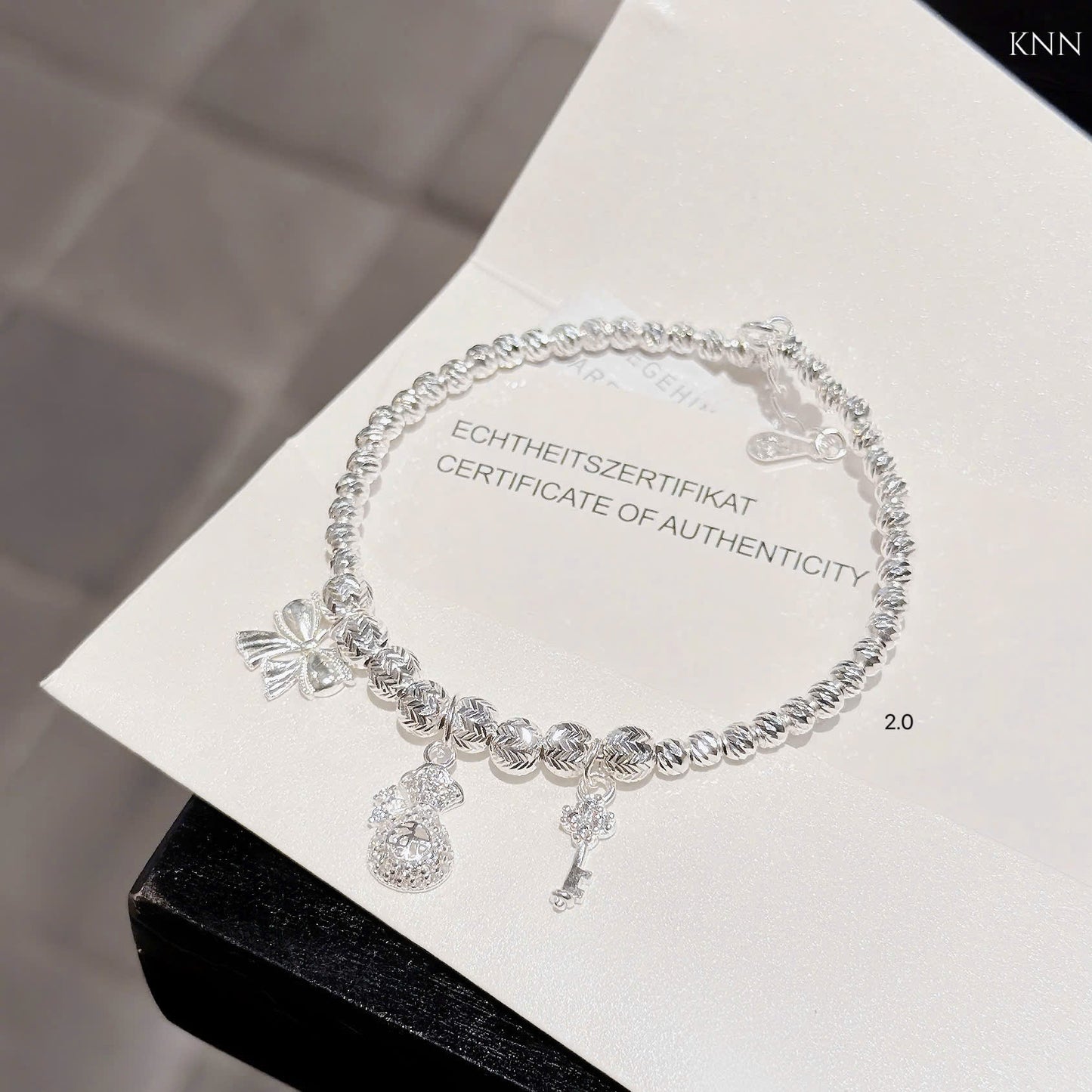 Lắc bạc nữ bi tròn phối charm xinh