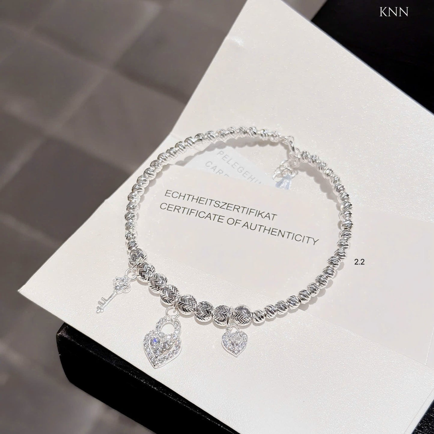 Lắc bạc nữ bi tròn phối charm xinh