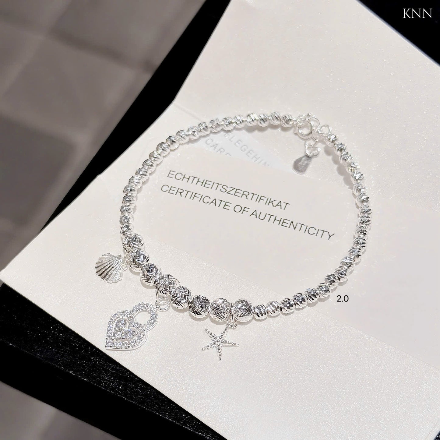 Lắc bạc nữ bi tròn phối charm xinh