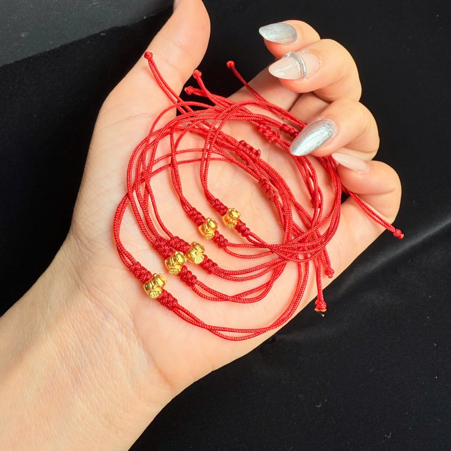 Vàng 24k mèo thần tài chỉ đỏ
