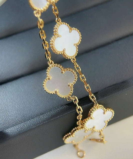 Vòng vip VCA titan phun vàng 14k đá trắng xà cừ